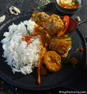 Serving presentation pork and lemongrass meatballs in Thai red curry sauce from my Thai curry